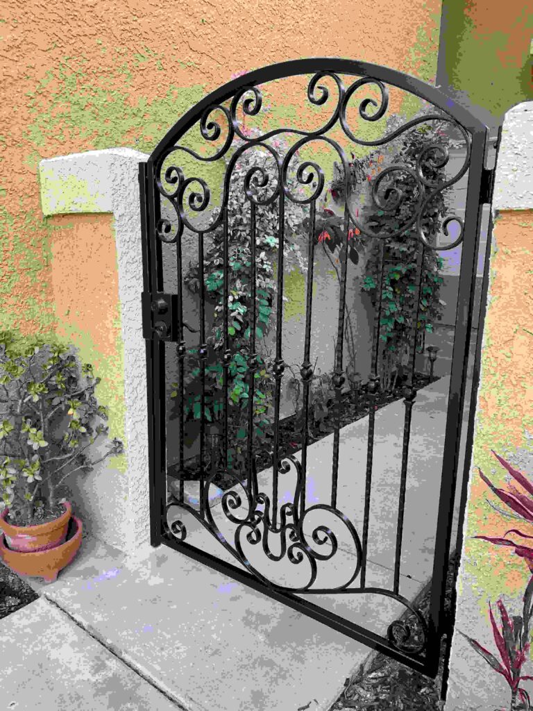 A gate with an iron design on it